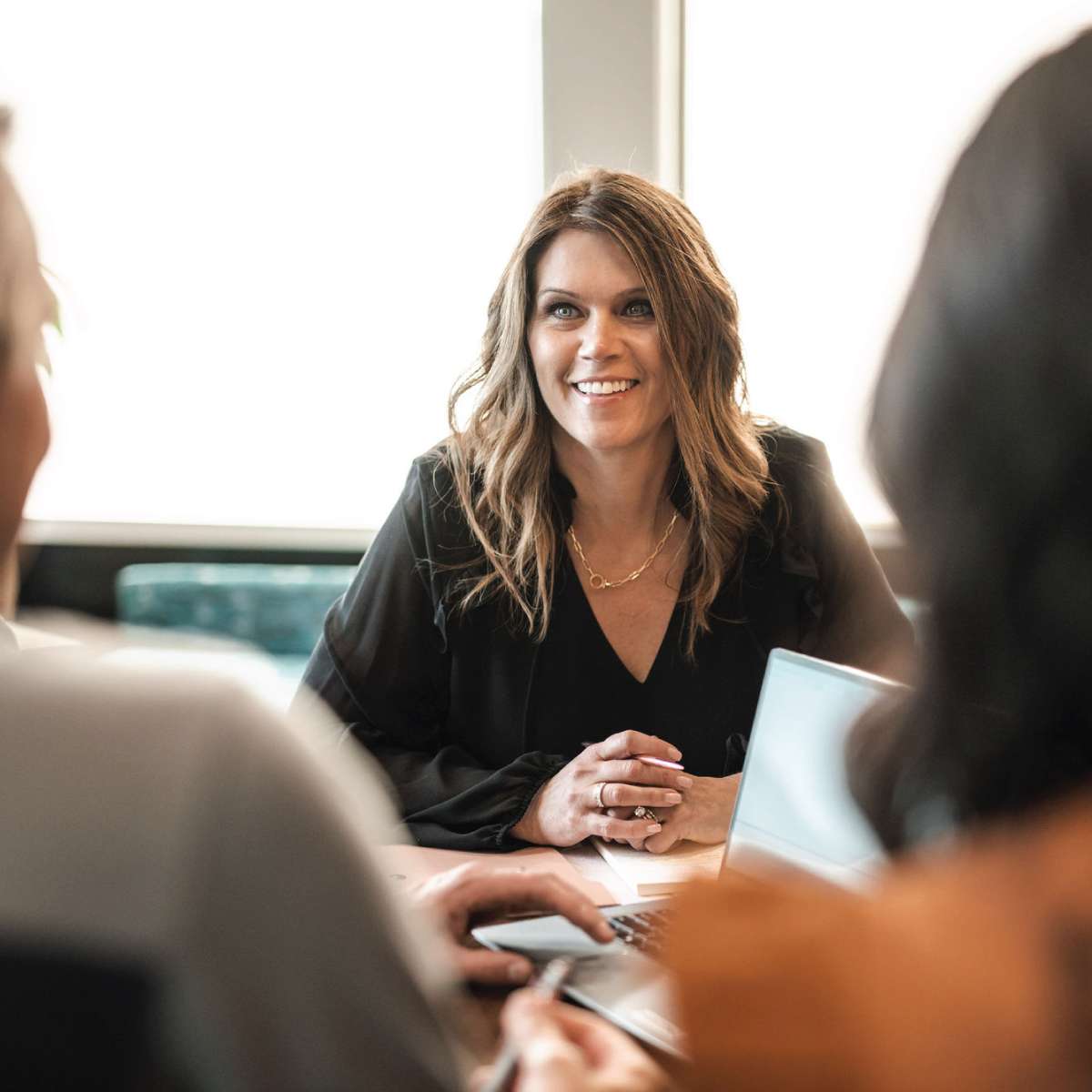 Certified financial planner meeting with clients in Bozeman